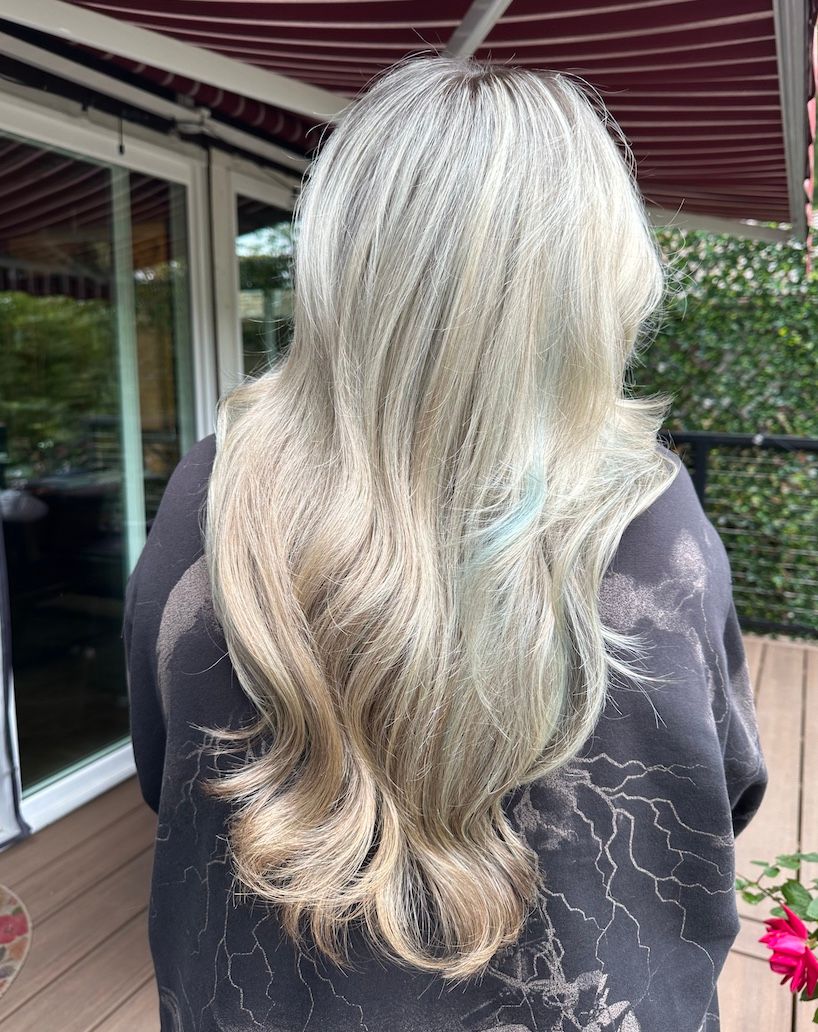 Long silver blonde with loose waves, seen from behind