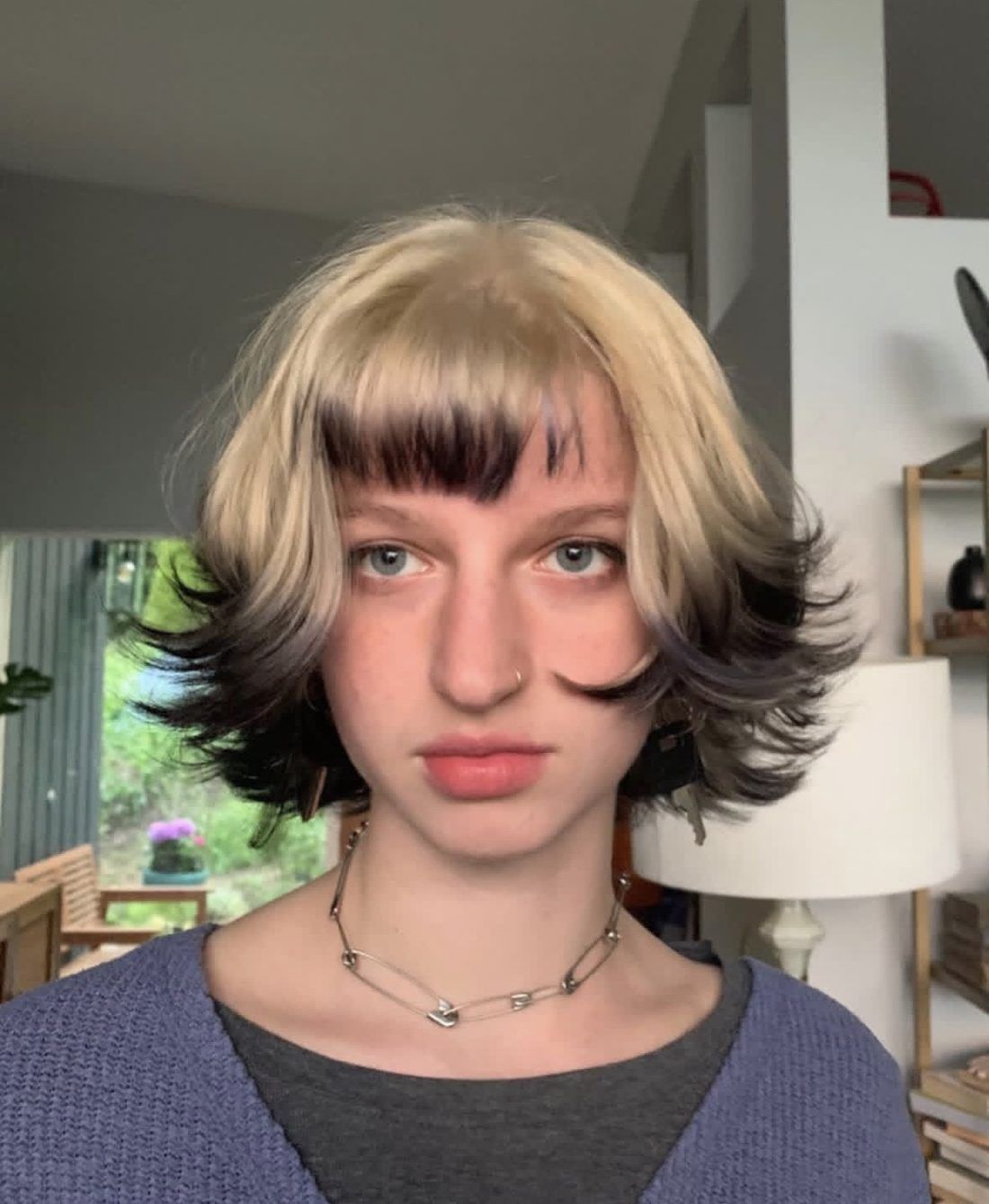 Blonde and black two-tone shag with curtain bangs